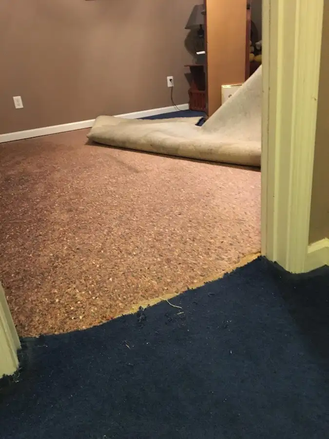 Carpet pad removal revealing water damage during Drying & Dehumidification in Heeia