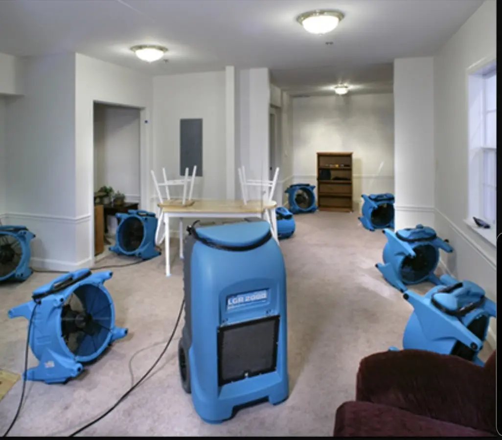 Air movers and dehumidifier setup for Water Damage Restoration in Heeia